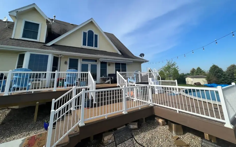 Photo of a multi-level deck with a curved deck design for the pool area