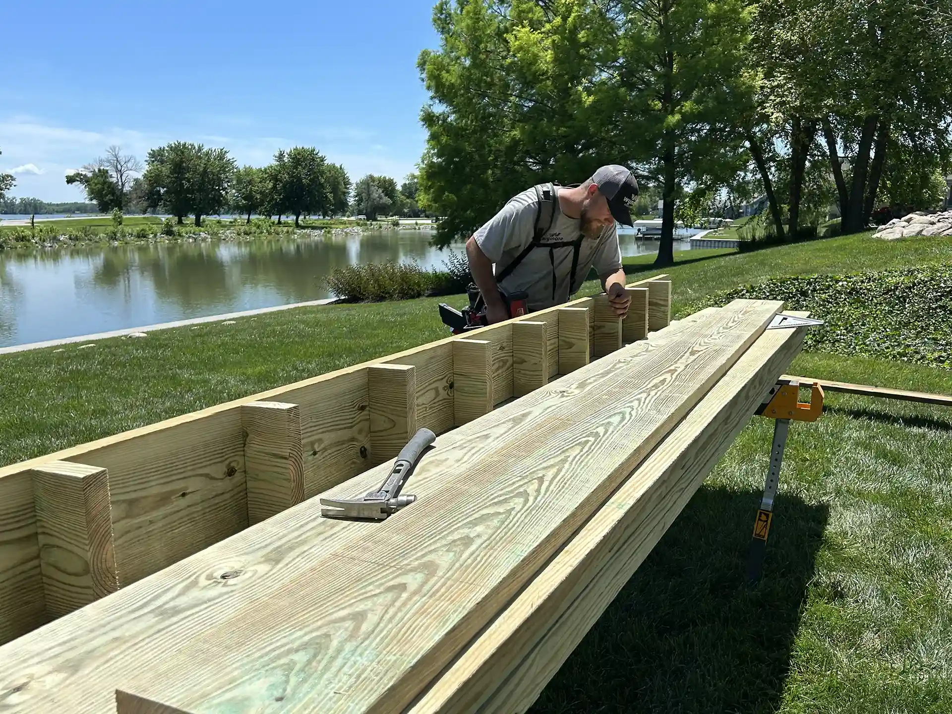 Photo of a deck contractor building the framing for an elevated deck