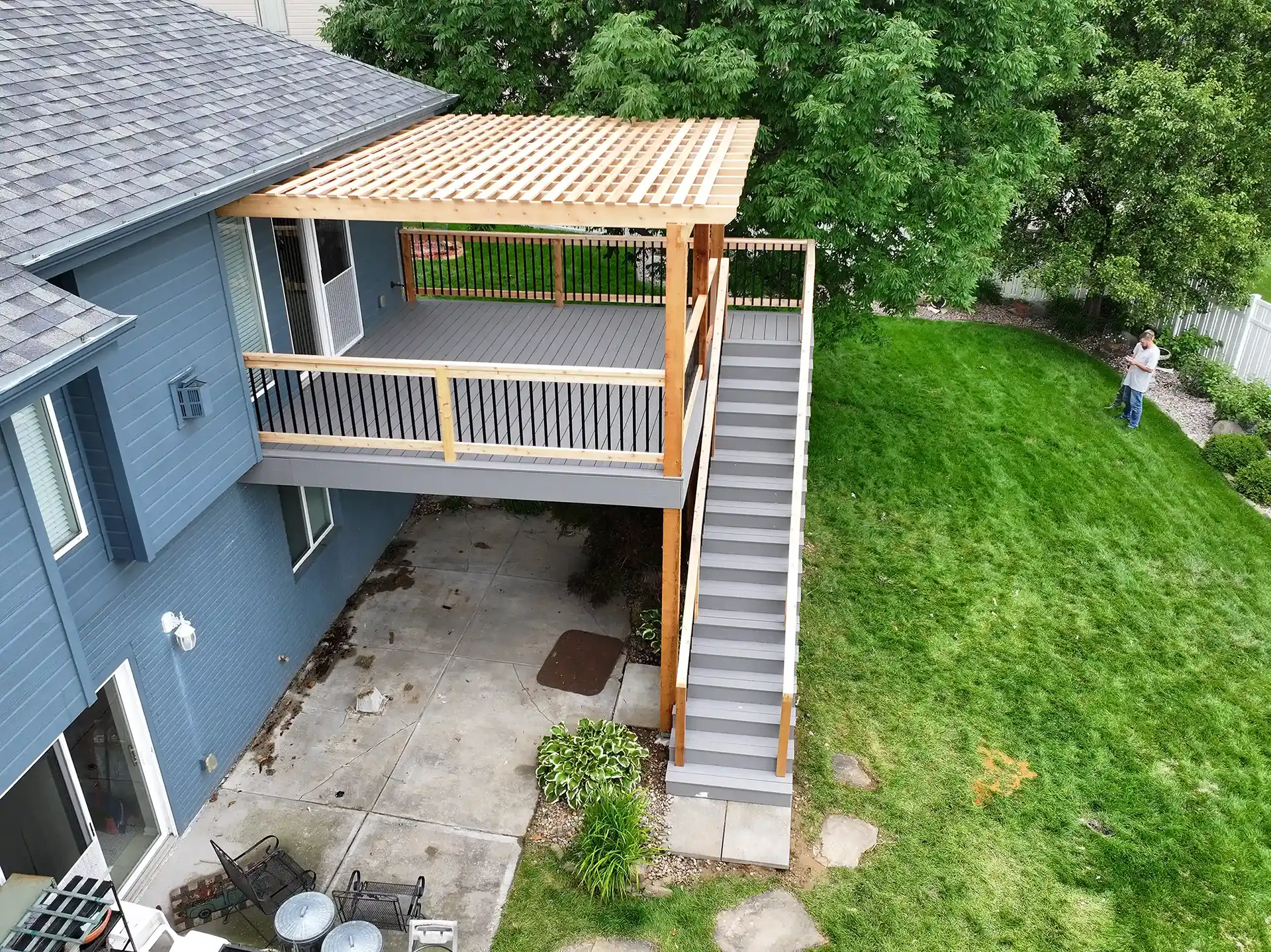 Photo of a custom deck with pergola that provides shade and keeps deck cooler