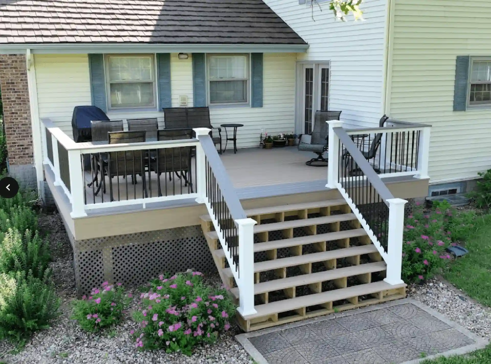 Photo of a composite deck built with TimberTech decking. Many people explore TimberTech vs Trex for their decking material.