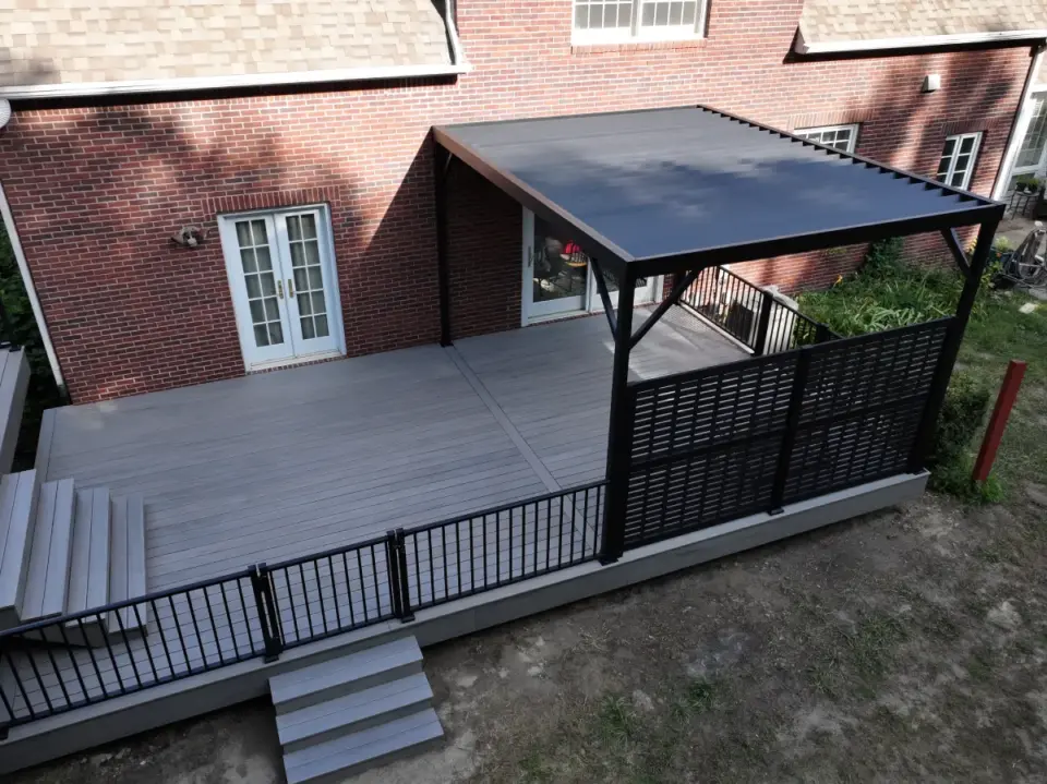 aerial-view-of-the-residential-deck-with-black-metal-railing-and-privacy-screen-with-pergola-in-omaha-ne