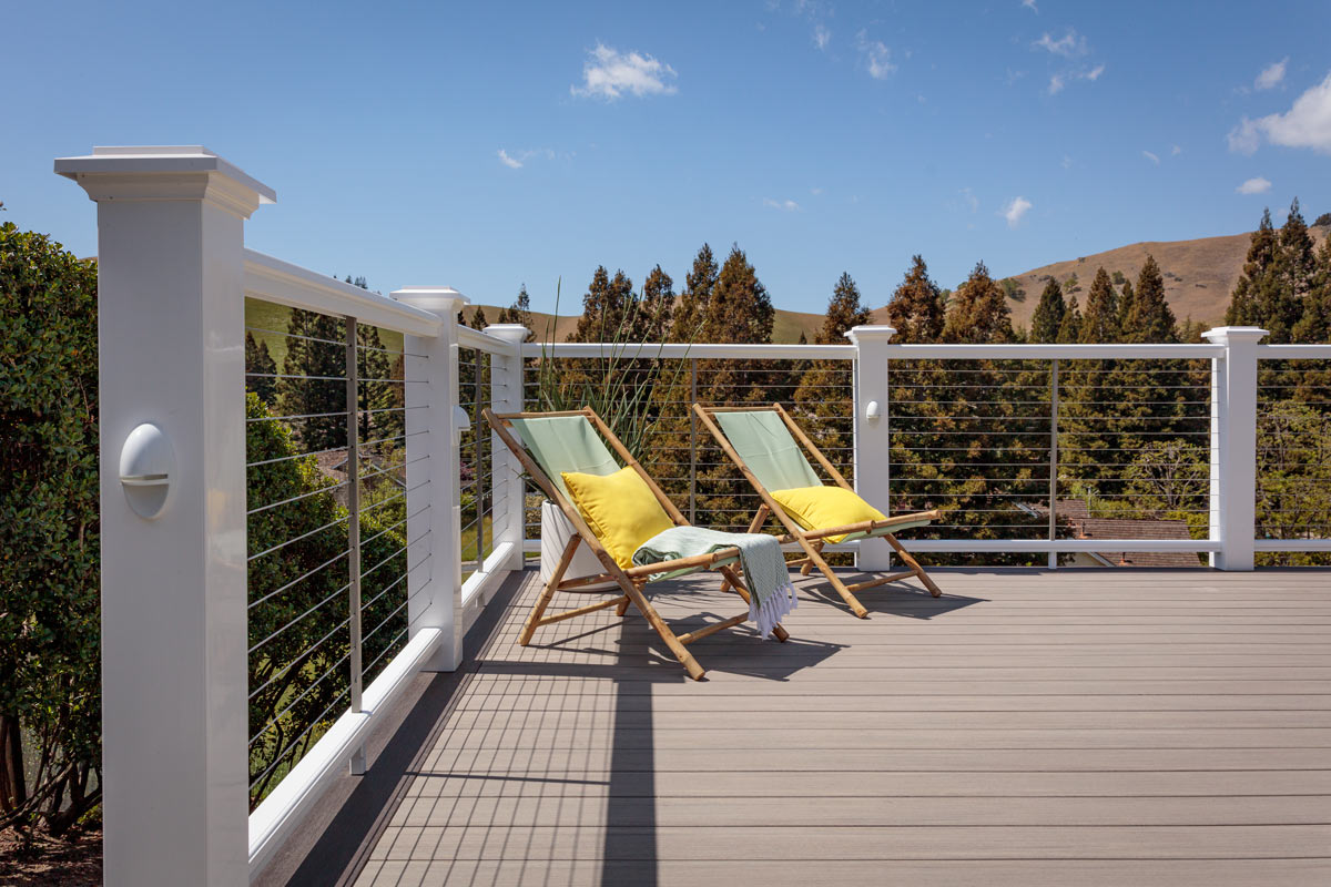 coastline-decking-with-wire-railing-and-outdoor-chairs-with-big-trees-on-the-background-in-omaha-ne