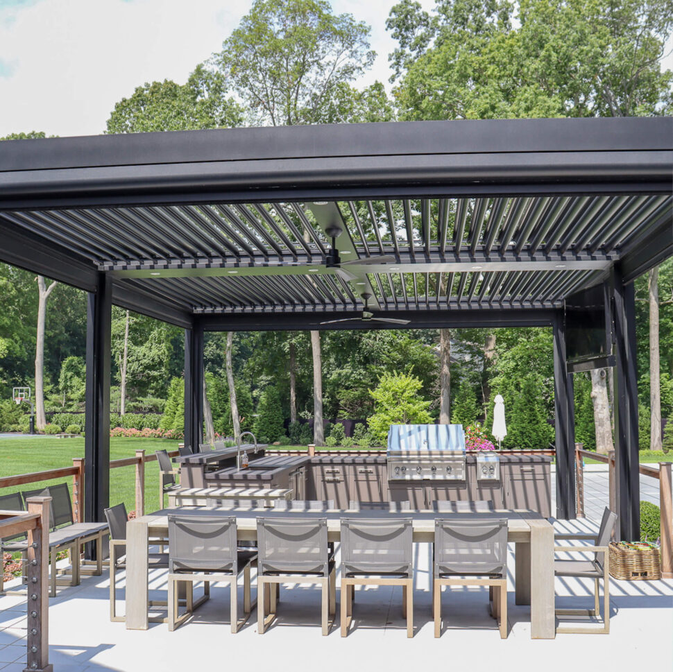 freestanding-pergola-with-outdoor-kitchen-and-a-long-table-with-chairs-in-omaha-ne