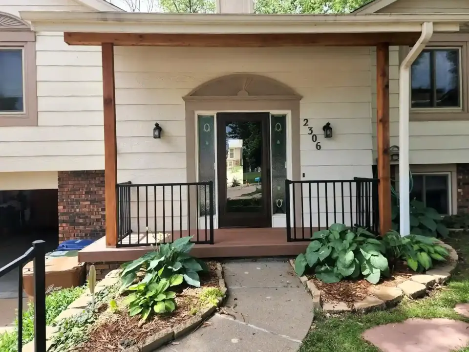 front-porch-construction-with-black-metal-railing-in-omaha-ne