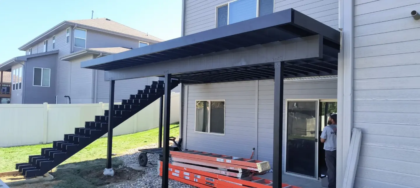 high-level-deck-installation-in-big-gray-house-in-omaha-ne