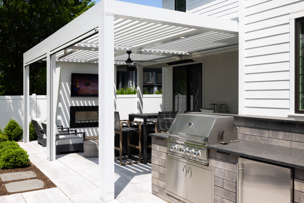 louvered-pergola-with-fire-place-and-outdoor-kitchen-in-omaha-ne