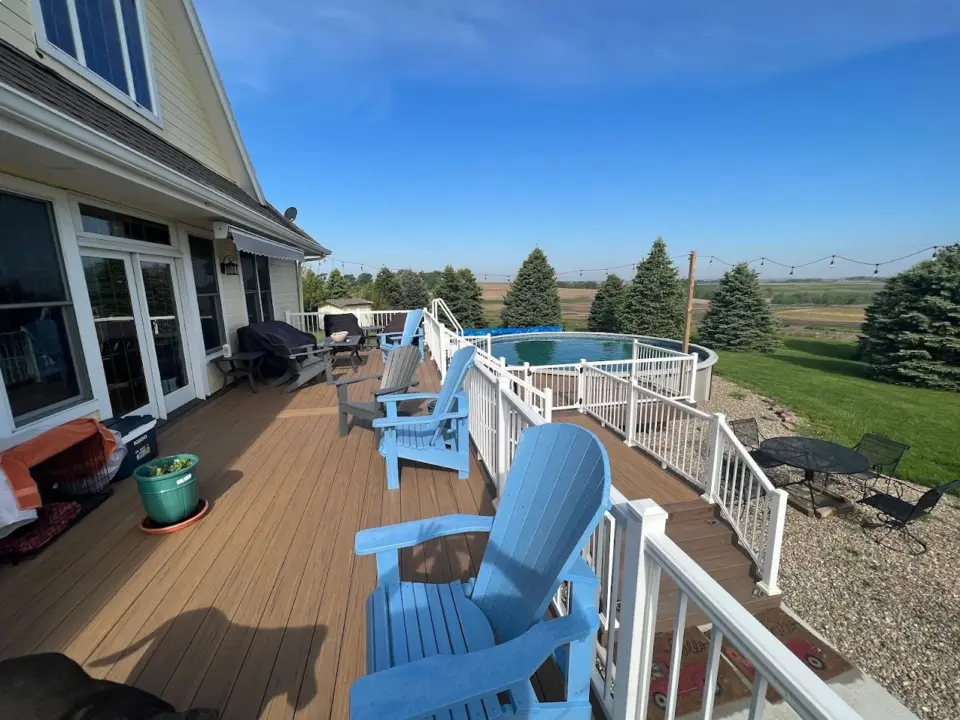 multi-level-deck-with-white-railing-and-outdoor-furniture-with-a-pool-in-omaha-ne