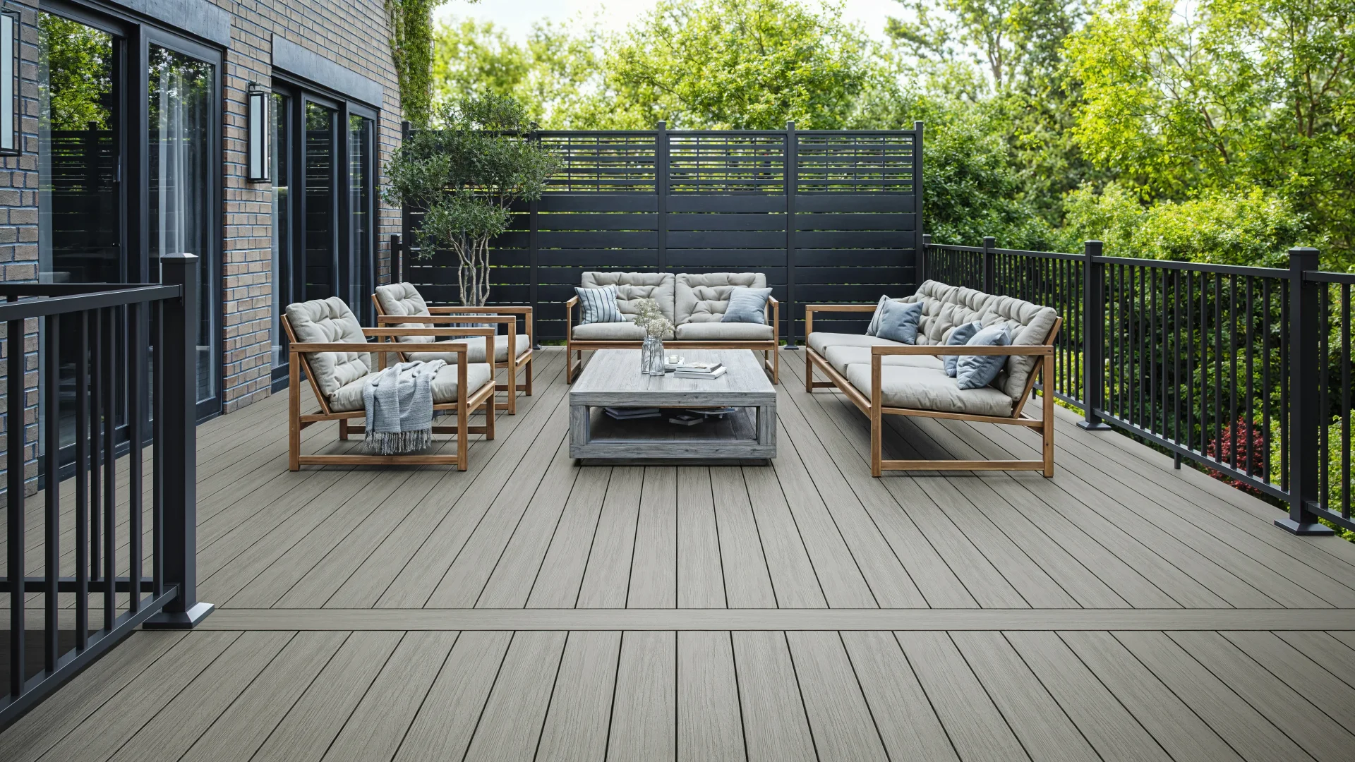 summit-decking-glacier-black-privacy-screens-with-outdoor-living-furniture-beside-the-black-metal-railing-in-omaha-ne