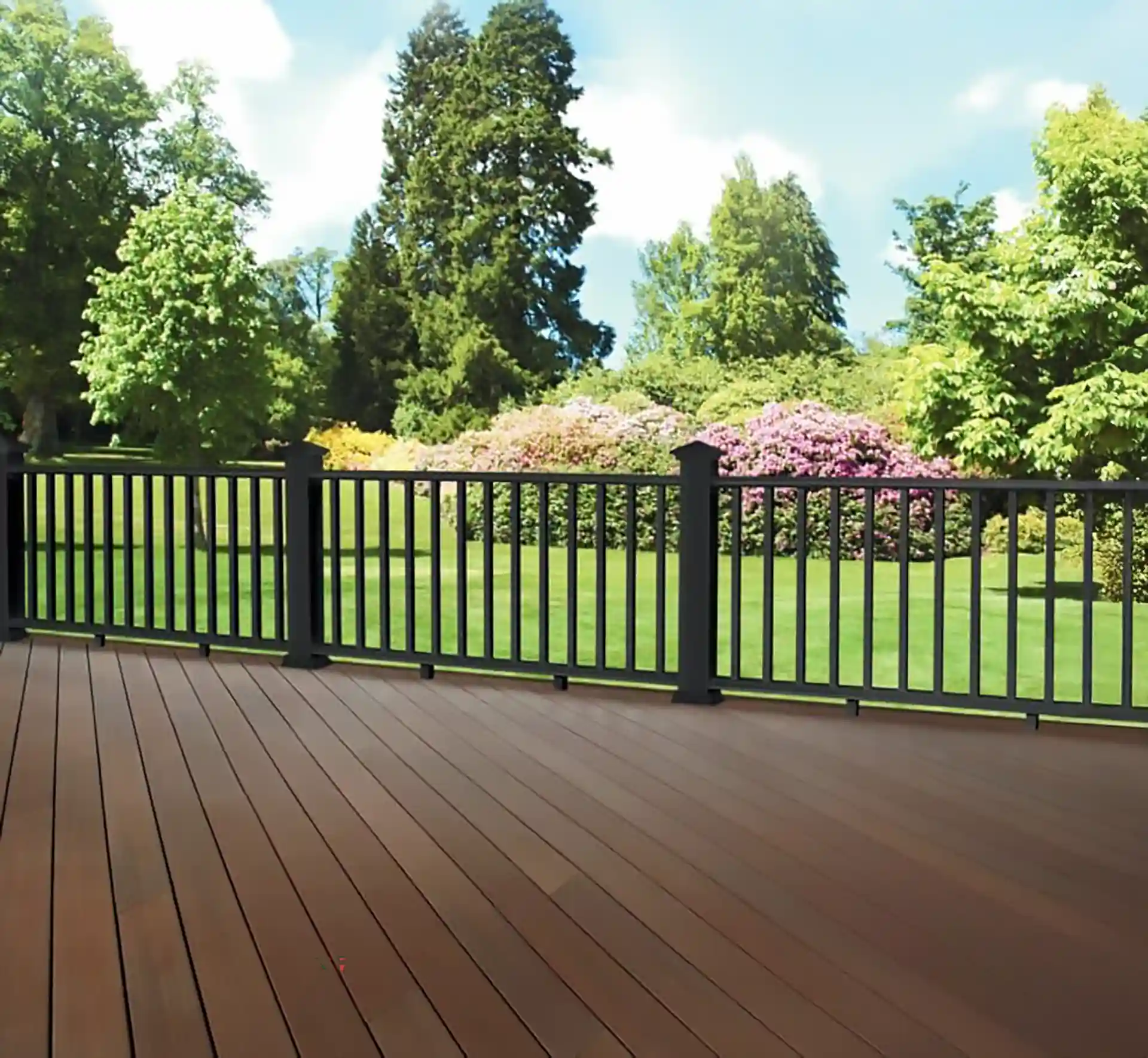 wood-deck-with-black-aluminum-railing-surrounded-by-the-trees-in-omaha-ne